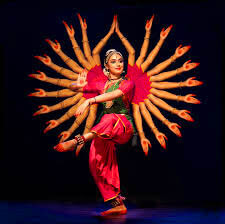 Bharatanatyam dancer performing at elegant Indian wedding ceremony